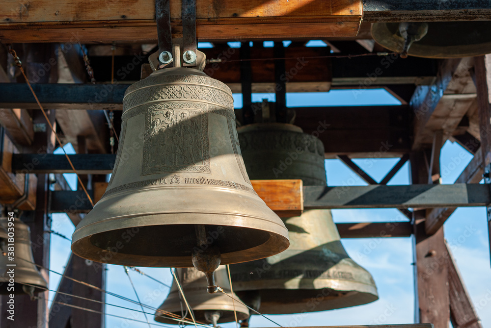 Church bells hanging in a wooden bell tower