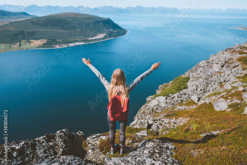 Traveler Woman tourist hands raised enjoying Norway landscape active healthy lifestyle adventure vacations outdoor happy emotions success concept © EVERST
