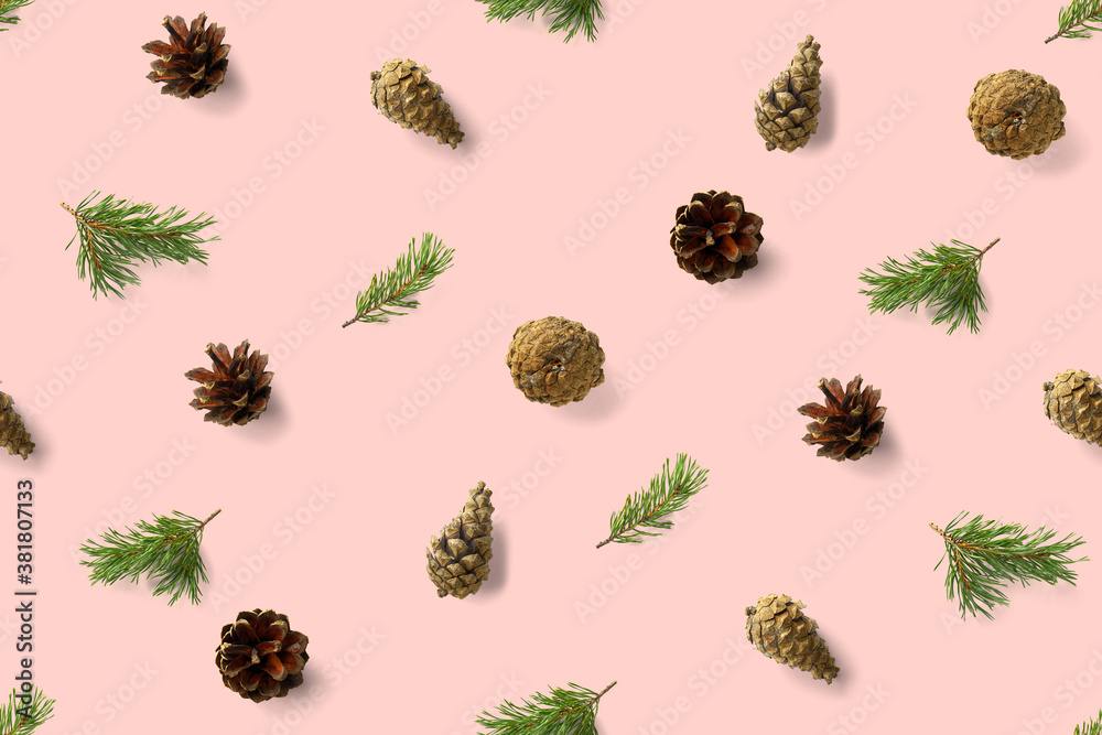 Fototapeta premium seamless christmas pattern from Pine cones on pink background. modern pine cone christmas collage. Print for paper, fabric, wallpaper pinecones