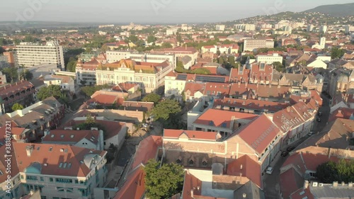 Aerial / drone footage of Pécs downtown, the fifth largest city of Hungary, a major cultural center, on the slopes of the Mecsek mountains, administrative and economic center of Baranya County photo