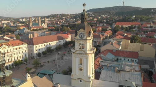 Aerial / drone footage of Széchenyi square of Pécs, the fifth largest city of Hungary, a major cultural center of Hungary, on the slopes of Mecsek mountains, administrative center of Baranya County photo