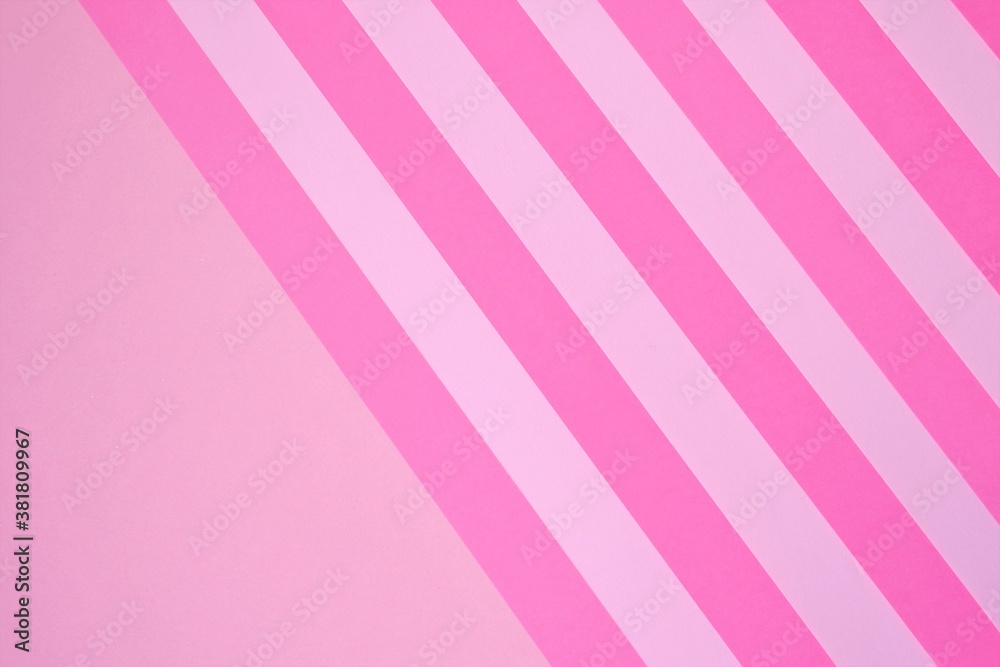 Pink striped paper background in pastel colors.Striped  background. paper abstract texture.wrapping paper.Color blocking background.bright pink striped lollipop background