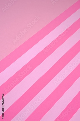 Pink striped paper background in pastel colors. geometric background. paper abstract texture.wrapping paper.Color blocking background.bright pink striped lollipop background