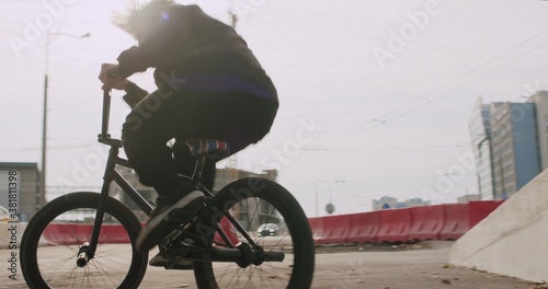 Extreme bmx cyclist doing bike tricks