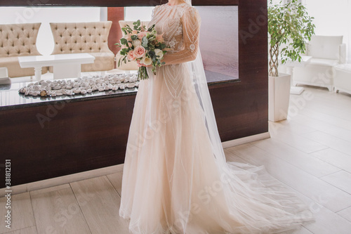 the bride in a wedding dress holds a bouquet © dyachenkopro