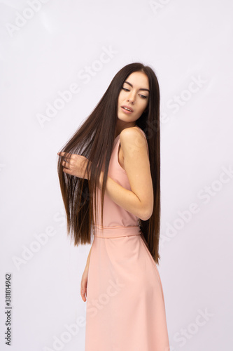 Young woman with long hair. Brunette