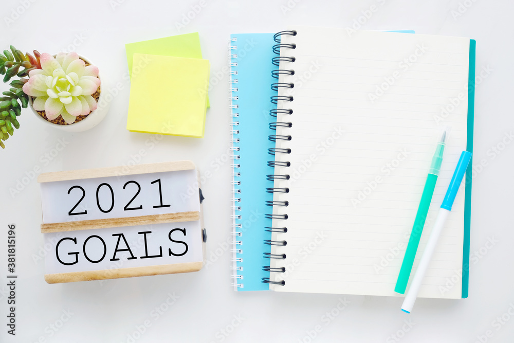 2021 goals on wood box and blank notebook paper on white marble background, 2021 business new year aim to success 2021 goals on wood box and blank notebook paper on white marble background, 2021 business new year aim to success