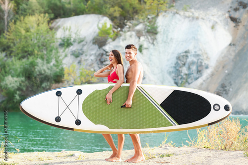 Young couple with board for...