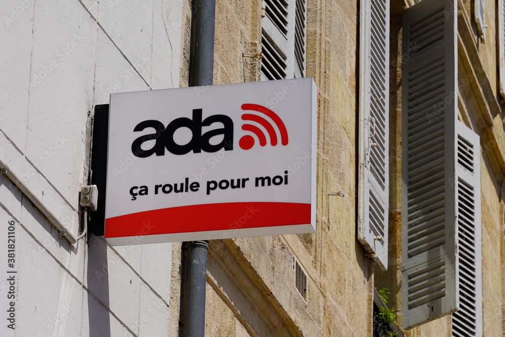 Ada Car Rental vehicles Office in France with red logo sign and text on store entrance Stock