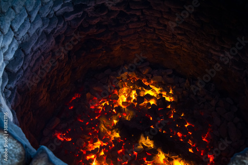 Traditional limestone kiln in Sri Lanka. Lime pit firing