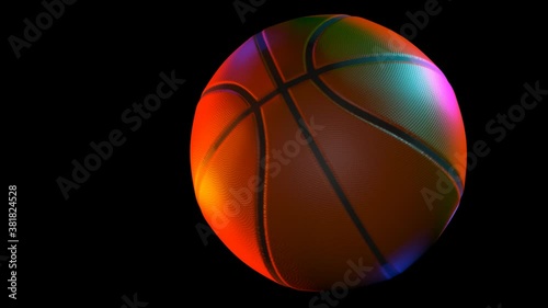 basketball spinning in multi colored light over black - 3d animation