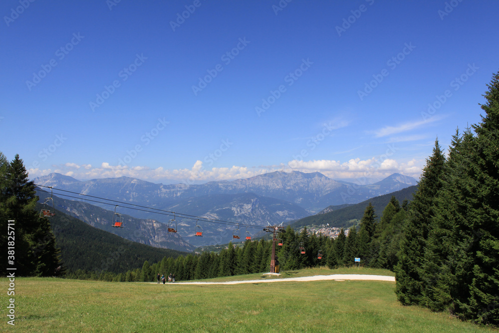 chairlift and beautiful natural landscape of mountains in Folgaria plateau, Italy