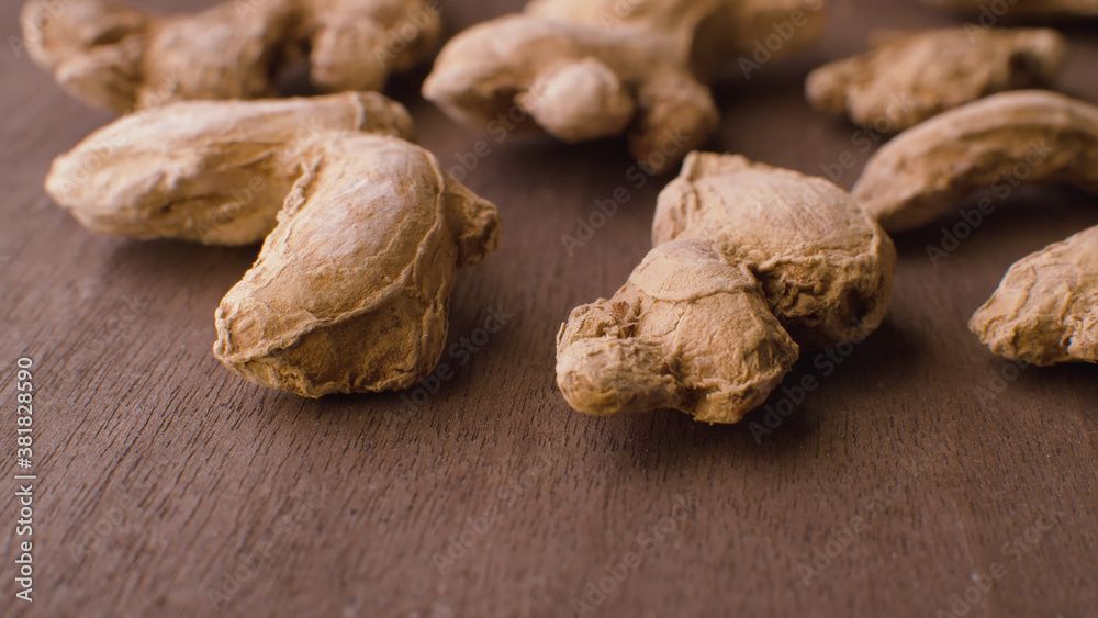 Fototapeta premium Ginger roots on the wooden table