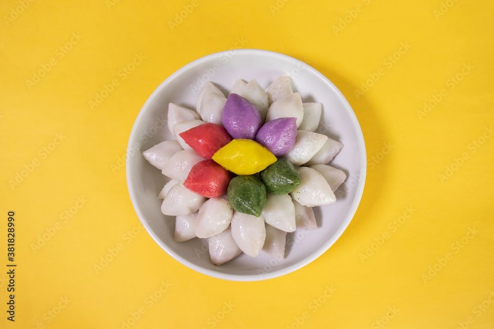 Songpyeon is half-moon shaped rice cake and stuffed with sesame seeds ...