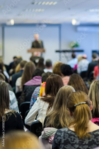 Professional Male Lecturer on Stage Speaking At The Conference.