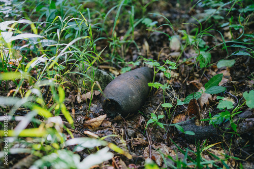 Valokuvatapetti Old mortar projectile left in nature
