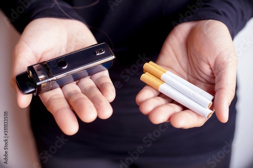 Woman holding a cigarette, focus hand