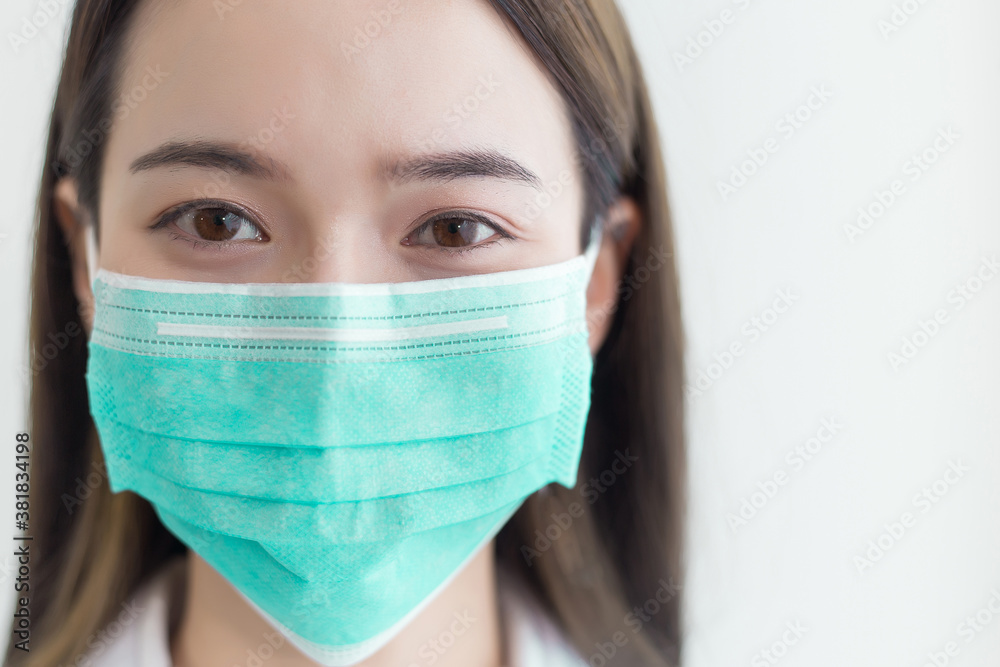 Asian beautiful woman wear a face mask to protect coronavirus. Asian beautiful woman wear a face mask to protect coronavirus.