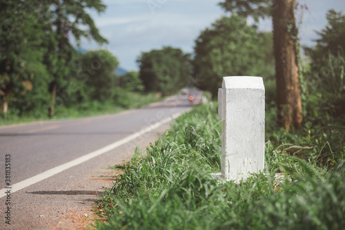 Bilde på lerret Empty white kilometer marker beside the road in Thailand.