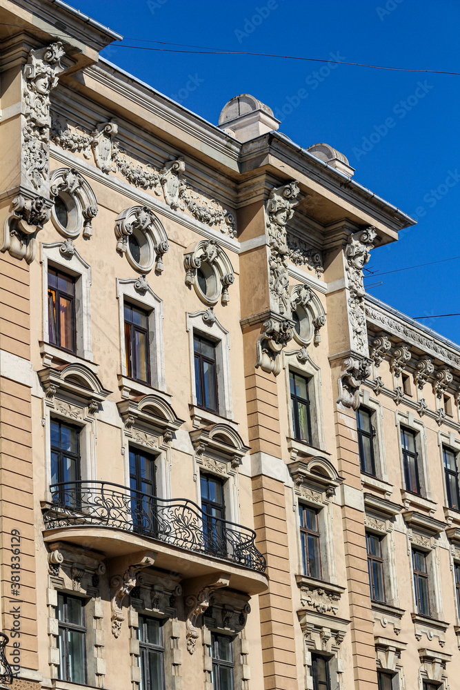 Exterior of old building with balcony in city Exterior of old building with balcony in city