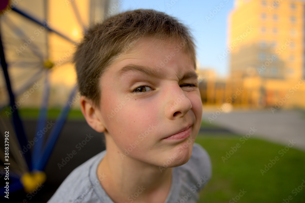 Portrait of a child who squints slyly Portrait of a child who squints slyly