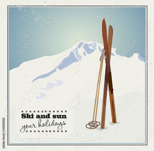 Obraz na plátně Vector winter themed template with wooden old fashioned skis and poles in the snow with snowy mountains and clear sky on background
