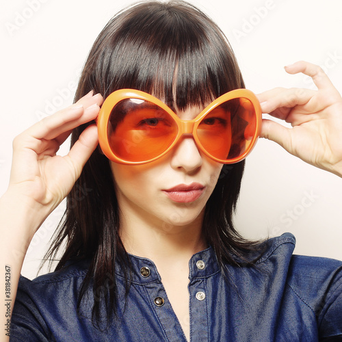 happy woman with big orange sunglasses
