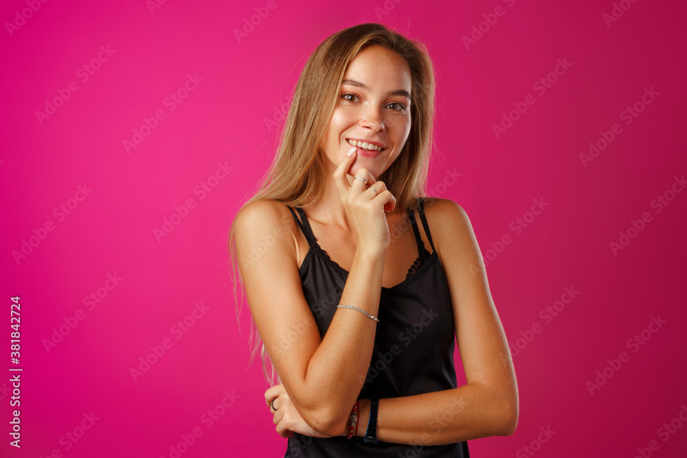 Fototapeta premium Portrait of a young beautiful happy woman smiling