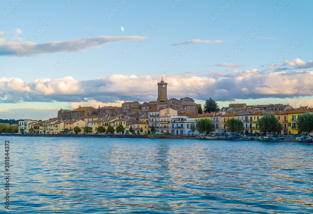 Marta (Italy) - A little medieval town on Bolsena lake with suggestive tower in stone; province of Viterbo, Lazio region. Here a view at sunset.