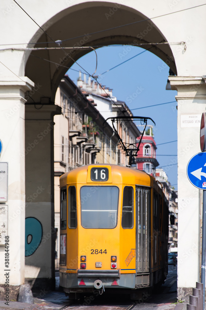 Orange tram in the streets of Turin