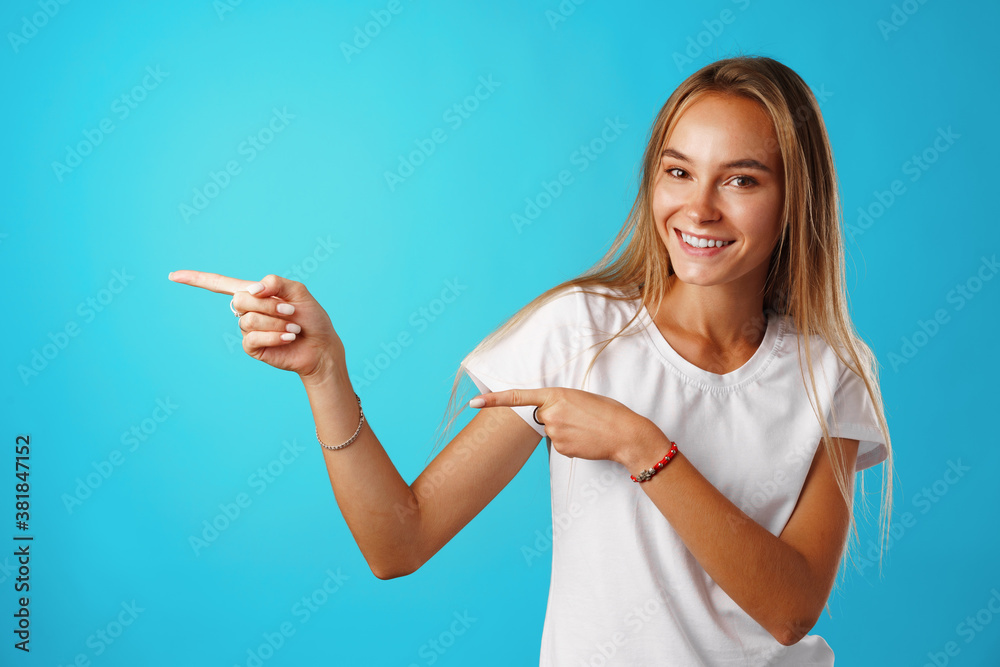 Portrait charming pretty cheerful girl showing copy space