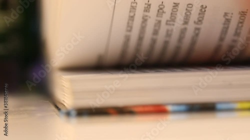 flipping pages quickly near the book side view, macro