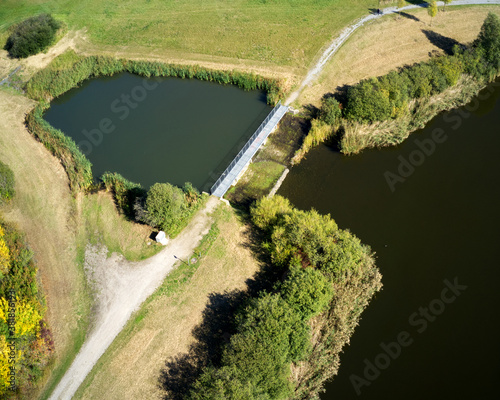 Obraz na plátně Aerial view of the antechamber of a rainwater retention basin with a green area