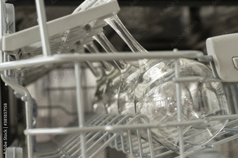glasses of wine are stacked rhythmically in the dishwasher. glasses of wine are stacked rhythmically in the dishwasher.