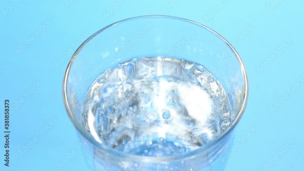 fresh sparkling water on blue background fresh sparkling water on blue background