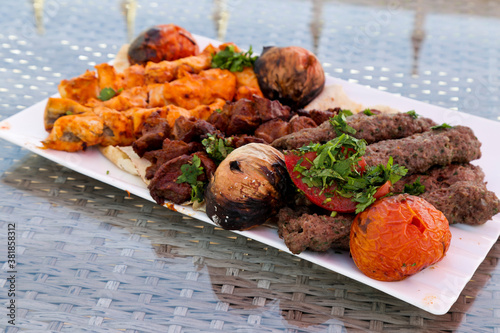 Arabic Meat Kabab and Chicken grill on plate outdoor | Mashawi Kabab & Tawook Traditional middle eastern BBQ kebab photo