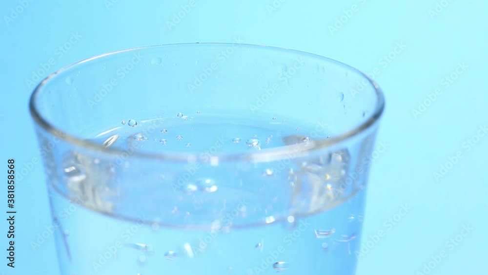 fresh sparkling water on blue background fresh sparkling water on blue background