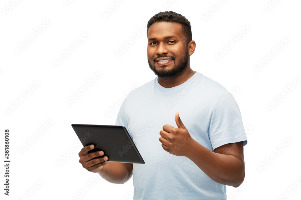 technology and people concept - happy young african american man with tablet computer showing thumbs up over white background technology and people concept - happy young african american man with tablet computer showing thumbs up over white background
