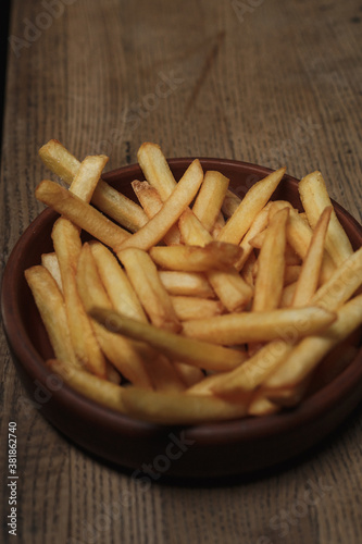 french fries on a wooden table