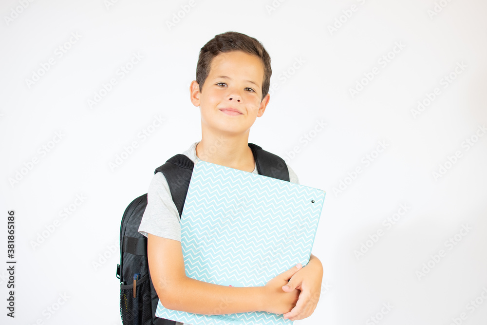 Child boy with book and bag over white background. Happy smiling kid go back to school. Child boy with book and bag over white background. Happy smiling kid go back to school.