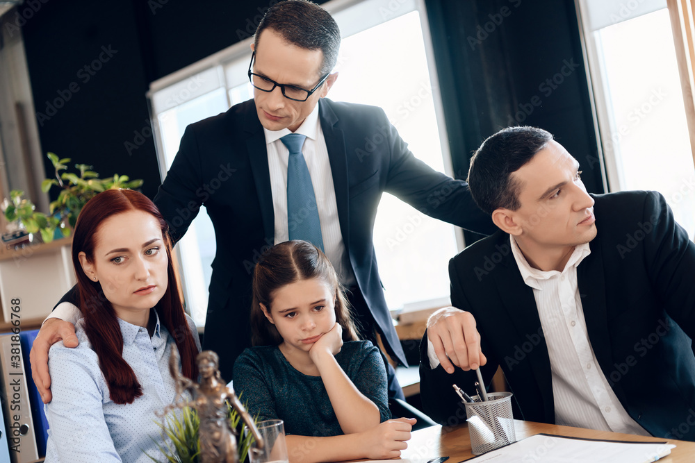 Lawyer in a suit supports a family. Lawyer in a suit supports a family.