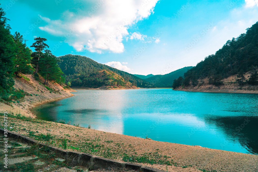 Sunnet Lake, blue water and blue sky, Mountain Forests at the far end, Bolu, Turkey