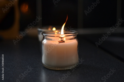 burning candles with wooden wick