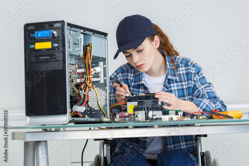 Wallpaper Mural young woman fix pc component in service center Torontodigital.ca