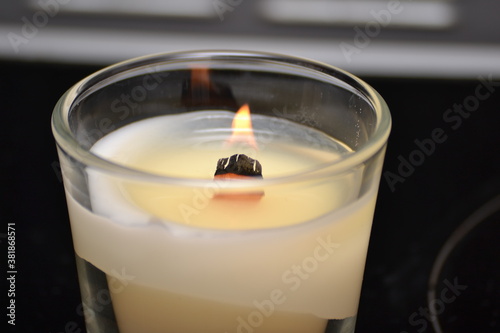 burning candles with wooden wick
