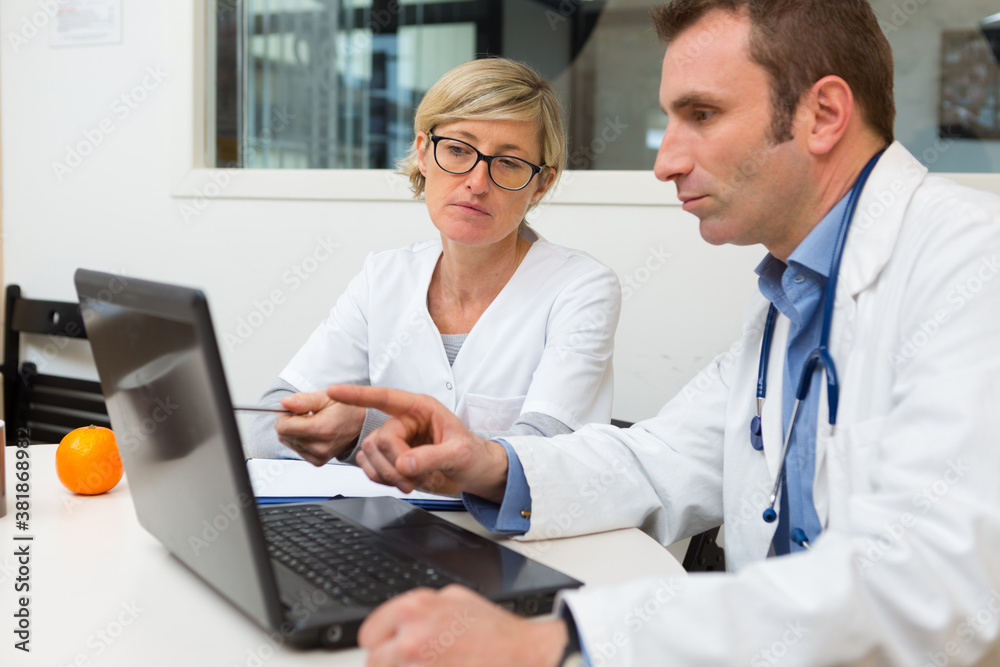 portrait of doctors in an office portrait of doctors in an office