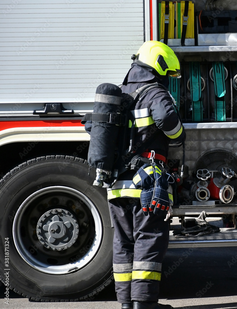 Fototapeta premium Firefighter at the scene of a fire