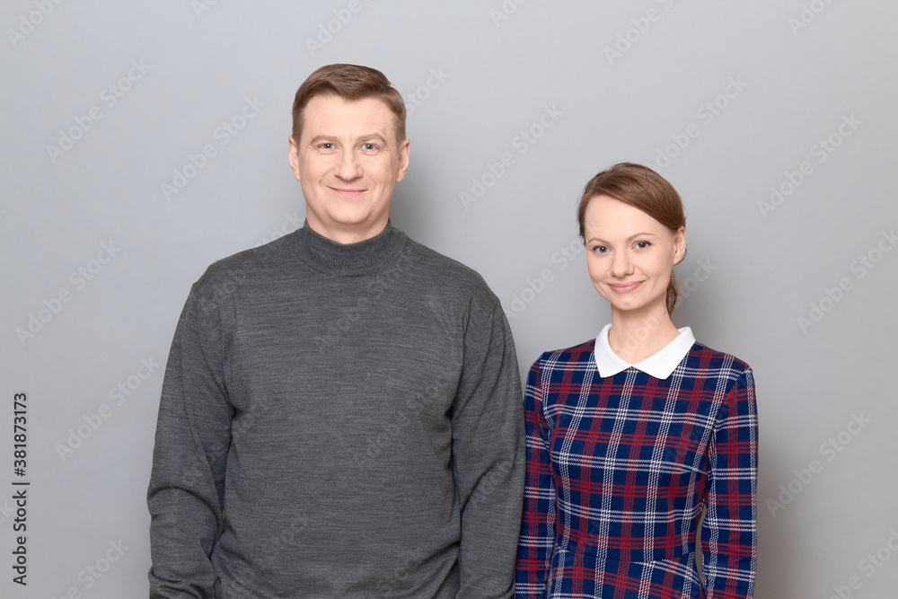 Portrait of happy joyful man and woman standing together and smiling Portrait of happy joyful man and woman standing together and smiling