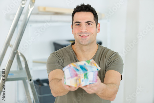 man saving lots of money by renovating house himself