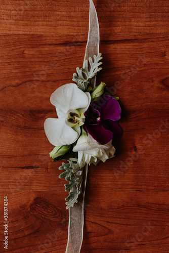 Photography Overhead shot of a bridal corsage for bridesmaid made of orchids